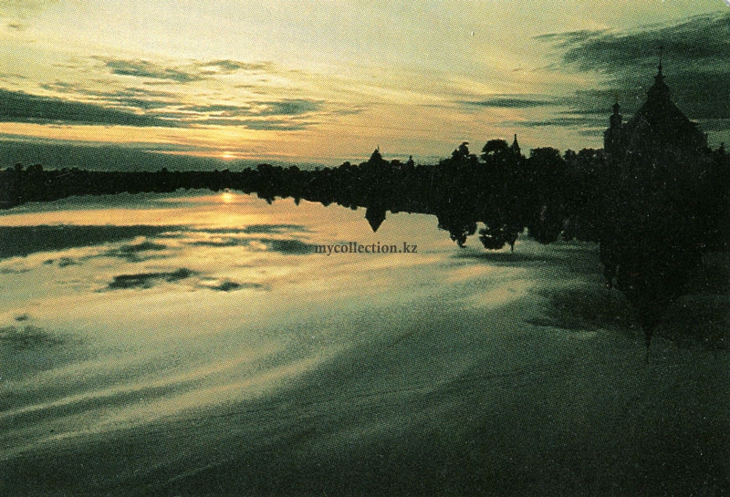 Sunset-over-the-river-with-a-church-on-the-shore.jpg